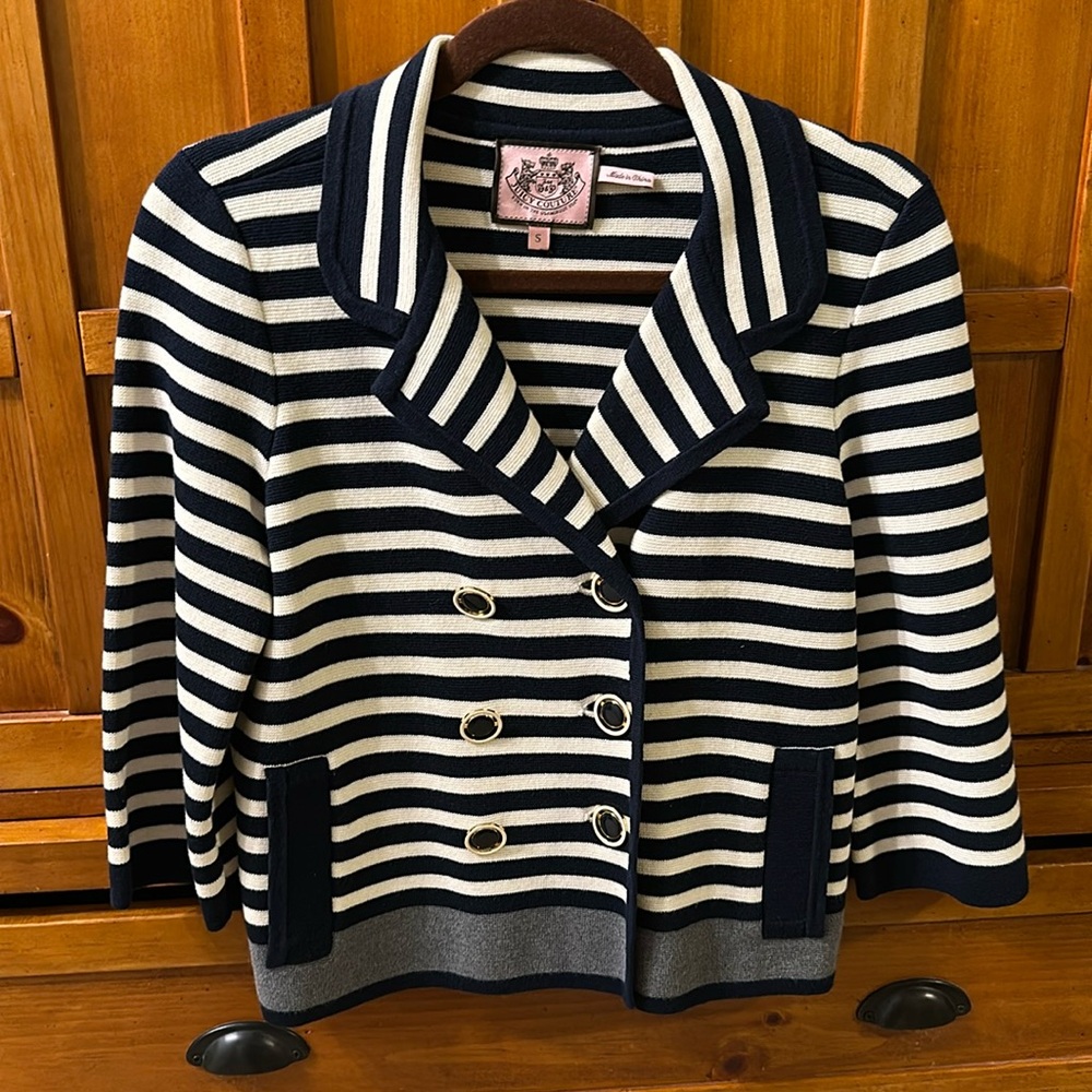 Nautical style, navy blue and white striped with a grey stripe on the bottom.
